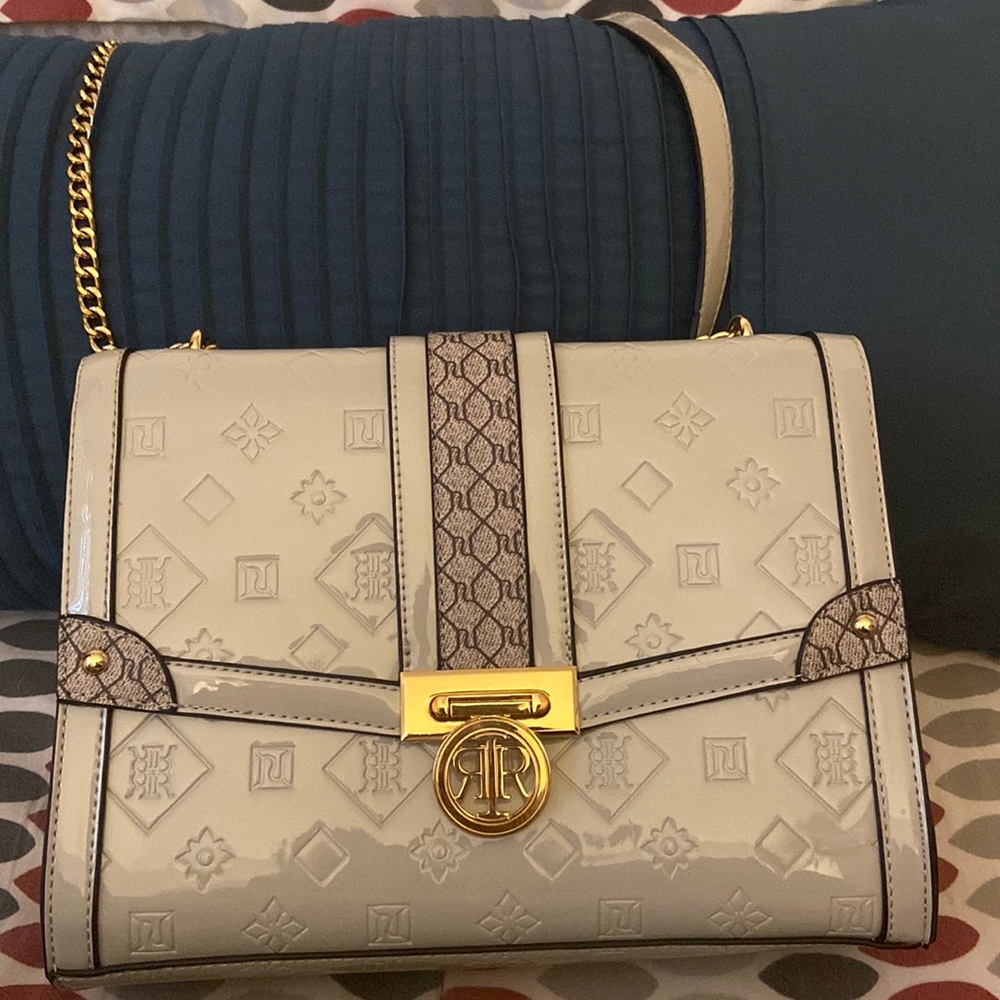 From River Island . A Grey embossed patent monogram shoulder bag .